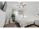 Inviting bedroom features a ceiling fan and unique vertical molding detail on the accent wall at 226 Smith Dr, Durham, NC 27712