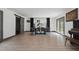 Dining room with black curtains, wood floors and views from the window at 226 Smith Dr, Durham, NC 27712