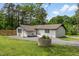 White brick ranch-style home with a well-maintained yard at 226 Smith Dr, Durham, NC 27712