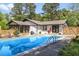 Stunning backyard pool with ample deck space, BBQ grill and lounge chairs, perfect for outdoor entertaining at 226 Smith Dr, Durham, NC 27712