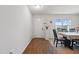 Inviting dining area with wood floors, neutral carpet, and a view to the home's front yard at 227 Sumter Ct, Burlington, NC 27217
