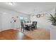 Inviting dining area with wood floors, neutral carpet, and a view to the home's front yard at 227 Sumter Ct, Burlington, NC 27217