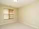 Neutral bedroom featuring a window with blinds and carpeted floors at 23 Great View Ct, Clayton, NC 27527