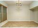 Elegant dining room featuring hardwood floors, natural light, and a stylish chandelier, perfect for gatherings at 23 Great View Ct, Clayton, NC 27527
