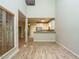 Bright, open living space with hardwood floors, connecting the kitchen and dining area for easy entertaining at 23 Great View Ct, Clayton, NC 27527