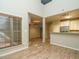 Open-concept layout with hardwood floors, seamlessly connecting the living area, dining space, and kitchen at 23 Great View Ct, Clayton, NC 27527