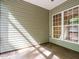 Sunroom with screened windows and a concrete floor at 23 Great View Ct, Clayton, NC 27527