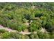 Aerial view of home surrounded by lush greenery, with a swimming pool and ample yard space at 2312 Laurelford Ln, Wake Forest, NC 27587