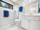 This bathroom features a glass shower door, natural lighting, and modern white vanity at 2312 Laurelford Ln, Wake Forest, NC 27587
