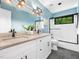 This bathroom features a double sink vanity, a walk in shower, and bright natural light at 2312 Laurelford Ln, Wake Forest, NC 27587