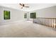 This expansive bonus room has lots of natural light and an open view of the lower level at 2312 Laurelford Ln, Wake Forest, NC 27587