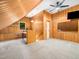 Bonus room with wood paneled walls, built in shelving, a ceiling fan, and recessed lighting at 2312 Laurelford Ln, Wake Forest, NC 27587