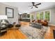 This open-concept living space with hardwood floors is adjacent to the kitchen, promoting a seamless flow for modern living at 2312 Laurelford Ln, Wake Forest, NC 27587