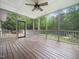 Spacious screened in porch with views of the fenced in pool and wooded back yard at 2312 Laurelford Ln, Wake Forest, NC 27587