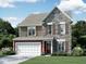 Charming two-story home featuring a stone facade, wood accents, attached two-car garage, and well-manicured lawn at 2384 Picual Way # 29, New Hill, NC 27562