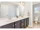 Bathroom features a double sink and tile flooring at 2437 Everstone Rd, Wake Forest, NC 27587