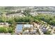 Aerial view of community amenities including tennis courts, a pool, a clubhouse, and a playground at 2437 Everstone Rd, Wake Forest, NC 27587