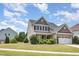 Traditional two-story home with a well-kept lawn and charming curb appeal at 2437 Everstone Rd, Wake Forest, NC 27587