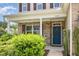 Charming two-story home with a welcoming front porch and well-manicured landscaping at 2437 Everstone Rd, Wake Forest, NC 27587