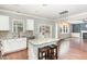 Open concept kitchen with modern island and hardwood floors offers seamless flow to the living area at 2437 Everstone Rd, Wake Forest, NC 27587