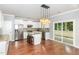 Bright kitchen features stainless steel appliances, granite countertops, and a central island at 2437 Everstone Rd, Wake Forest, NC 27587
