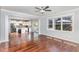 Open-concept living room flows into a modern kitchen with stainless steel appliances and a center island at 2437 Everstone Rd, Wake Forest, NC 27587