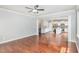 Spacious living room with hardwood floors offering a seamless transition to the adjacent kitchen at 2437 Everstone Rd, Wake Forest, NC 27587