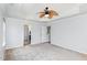 Comfortable main bedroom with a tray ceiling and fan, plus easy access to the ensuite bathroom at 2437 Everstone Rd, Wake Forest, NC 27587