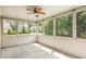 Screened-in patio with a ceiling fan overlooking the backyard at 2437 Everstone Rd, Wake Forest, NC 27587