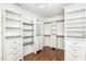 A very large walk-in closet with custom shelving and drawers for storage at 2437 Everstone Rd, Wake Forest, NC 27587