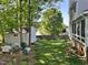 Backyard featuring a lawn, shed, and a lush garden area, perfect for outdoor activities at 2528 Beech Gap Ct, Raleigh, NC 27603