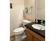 Functional half bath with vanity, granite countertop, and neutral decor at 2528 Beech Gap Ct, Raleigh, NC 27603