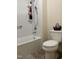 Clean bathroom offers a shower-tub combination and built-in shelving at 2528 Beech Gap Ct, Raleigh, NC 27603