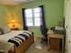 Cozy bedroom with natural light, desk, and vibrant walls at 2528 Beech Gap Ct, Raleigh, NC 27603