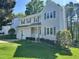 Charming two-story home with a well-manicured lawn, attached garage, and inviting front porch at 2528 Beech Gap Ct, Raleigh, NC 27603