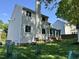 Home exterior featuring a well-maintained lawn and flower garden with large screened in porch at 2528 Beech Gap Ct, Raleigh, NC 27603
