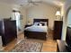 Main bedroom with vaulted ceiling, ceiling fan, wood floor, and stylish decor at 2528 Beech Gap Ct, Raleigh, NC 27603