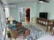 Bright and airy sunroom with tile flooring, cozy seating, and views of the outdoors at 2528 Beech Gap Ct, Raleigh, NC 27603