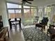 Bright sunroom features a tile floor, ceiling fan, and large windows providing ample natural light at 2528 Beech Gap Ct, Raleigh, NC 27603