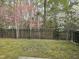 Beautiful backyard with a black fence and flowering trees at 2565 Bent Green St, Raleigh, NC 27614