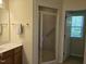 Bathroom featuring a framed shower, a vanity with a mirror, and a bright, airy design at 2565 Bent Green St, Raleigh, NC 27614