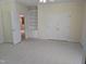Generously sized bedroom with neutral carpeting, ample closet space, and natural light at 2565 Bent Green St, Raleigh, NC 27614