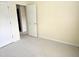Bright bedroom featuring neutral carpeting and two doors offering easy access to other areas at 2565 Bent Green St, Raleigh, NC 27614