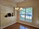 Bright dining room featuring hardwood floors, a chandelier, and a built-in display nook at 2565 Bent Green St, Raleigh, NC 27614