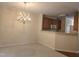 Spacious dining room featuring a classic chandelier and an open view to the kitchen area at 2565 Bent Green St, Raleigh, NC 27614