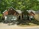 Charming brick home featuring an attached two-car garage and lush landscaping at 2565 Bent Green St, Raleigh, NC 27614