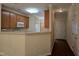 Kitchen with wood cabinets, view into the entry and hallway at 2565 Bent Green St, Raleigh, NC 27614