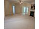 Expansive living room boasting neutral carpeting and a fireplace for a cozy ambiance at 2565 Bent Green St, Raleigh, NC 27614
