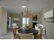 Open-concept living room features a chandelier, fireplace, and access to outdoor space at 2565 Bent Green St, Raleigh, NC 27614