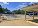 Community pool with kiddie area, shade umbrellas, and lounge chairs at 2565 Bent Green St, Raleigh, NC 27614